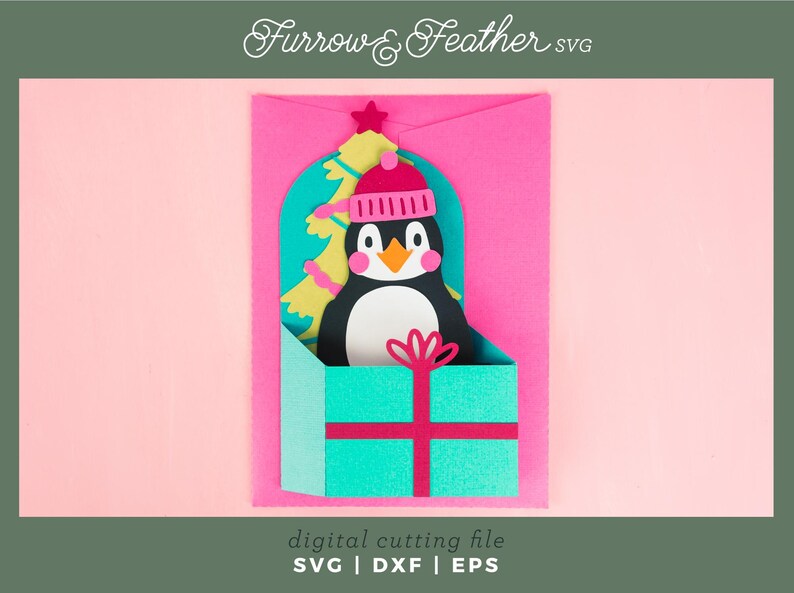 May include: A digital cutting file for a penguin wearing a pink hat and holding a Christmas tree inside a teal gift box. The file is available in SVG, DXF, and EPS formats. Furrow & Feather SVG.