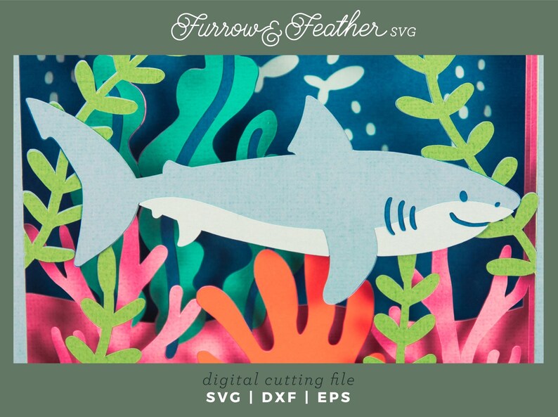 Puede incluir: Un tibur&oacute;n azul claro nada entre coloridos corales y algas marinas en este dise&ntilde;o de archivo de corte digital. La imagen incluye el texto "Furrow & Feather SVG" y "digital cutting file SVG | DXF | EPS". El dise&ntilde;o es adecuado para proyectos de manualidades.