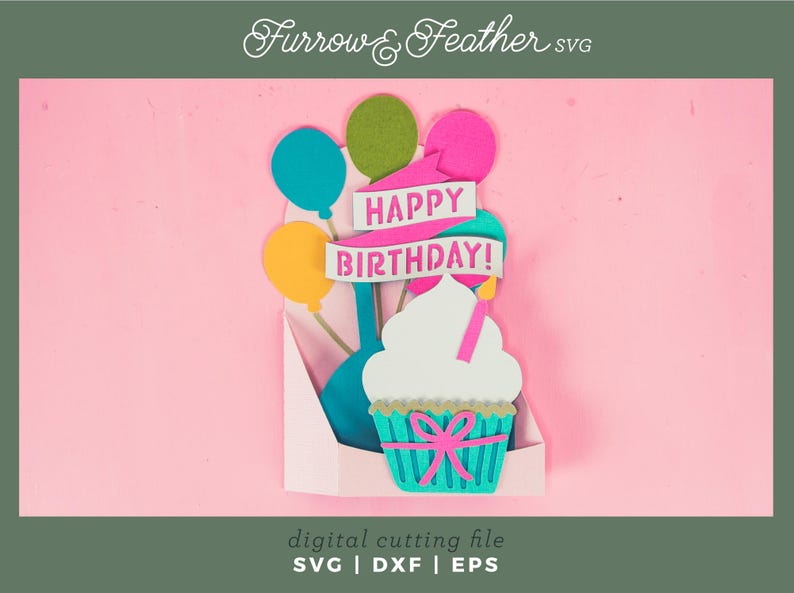 May include: A digital cutting file for a birthday card featuring a cupcake with a pink bow and a candle, surrounded by balloons and a banner that reads "Happy Birthday!"
