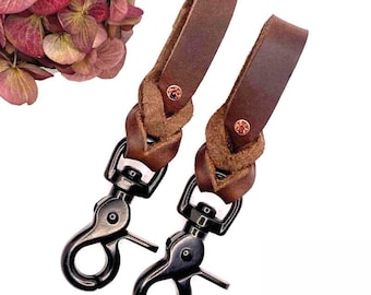 Stijgbeugelhouders (paar) met antieke roze strass-steentjes, gemaakt van geolied leer.