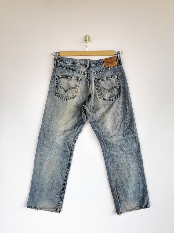 W32 vintage Levis Distressed Light Wash Jeans Levis 569 Femmes