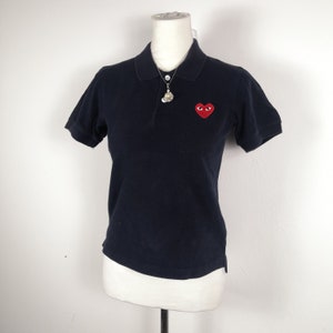 Camiseta vintage Comme des Garcons talla XS. Polo negro para mujer. Fabricado en Japón. Talla XS.