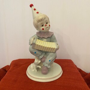 Porcelain boy clown with accordion