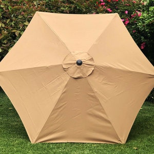 cantilever patio umbrella makeover Julie Baird | I've been looking for a better shade solution, and this  umbrella from @patioheatandshade is it. The 10 foot cantilever umbrella  covers our