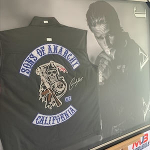 Charlie Hunnam Signed Sons of Anarchy Black Bikers Vest Authentication Framed Inscribed “JAX”