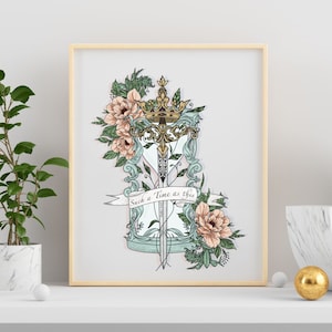 May include: A vintage-style hourglass with a sword and crown design, surrounded by delicate pink flowers and green leaves. The hourglass has a banner that reads "Such a Time as this".