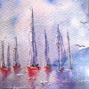 May include: Watercolour painting of sailboats on the water. The boats have red hulls and white sails, with a blue and purple sky in the background. Several birds are flying above the water.