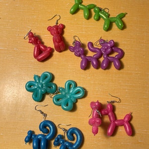 Squish-y Balloon Animal Earrings. Giraffes. Bear Cats? Dogs. Monkeys. Butterflies.