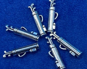 A Set of Silver Golf Clubs in a Golf Bag Charm and Pendants - Set of Six