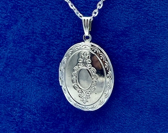 Bright Silver Oval Photo Locket with a Regency Floral Design with Silver Necklace.