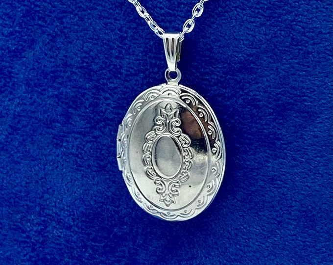 Bright Silver Oval Photo Locket with a Regency Floral Design with Silver Necklace.