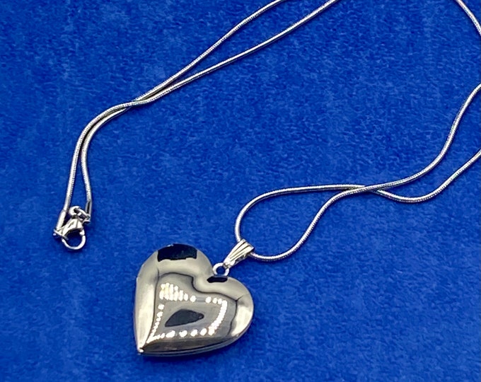 Bright Silver Heart Shaped Photo Locket with Silver Necklace.