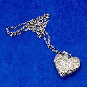 Silver Heart Shaped Photo Locket, Polished Stainless Steel Floral Engraved Pattern with Silver Necklace.