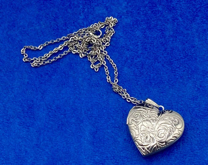 Silver Heart Shaped Photo Locket, Polished Stainless Steel Floral Engraved Pattern with Silver Necklace.