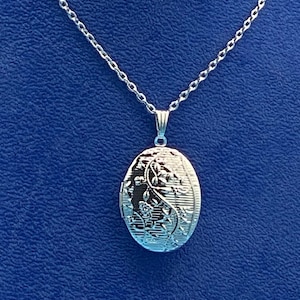 Bright Silver Oval Photo Locket with a  Modern Floral Design with Silver Necklace.