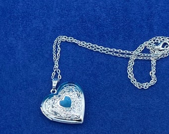 Silver Heart Shaped Photo Locket with Floral Pattern Edge complete with Silver Necklace.