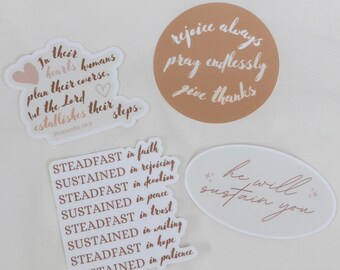 May include: A collection of stickers with inspirational quotes in a handwritten style. The stickers feature phrases like "rejoice always, pray endlessly, give thanks" and "he will sustain you." Other stickers include Bible verses.