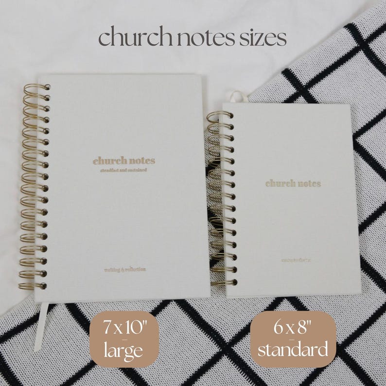 May include: Two spiral-bound notebooks with the text "church notes" in gold lettering. The larger notebook is 17.8x25.4 cm, and the smaller is 15.2x20.3 cm. The notebooks are white with gold spiral binding and a white ribbon bookmark.