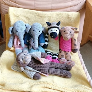 Crocheted cuddly toys (elephant, zebra, etc.) with clothes to put on and take off as a gift for birthdays, etc. as a doll, etc.