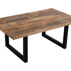 May include: A rectangular coffee table with a natural wood top and black metal legs. The tabletop has a warm, brown colour with visible wood grain. The legs are a simple, geometric design.