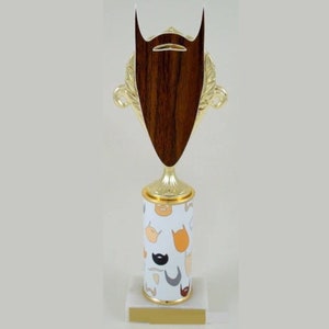 May include: Gold trophy with a wooden beard-shaped base. The base of the trophy is decorated with a white background and a pattern of colorful beards.