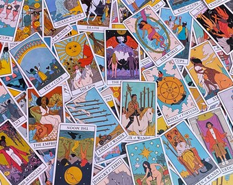 May include: A colorful deck of tarot cards with illustrations of people, animals, and symbols. The cards are arranged in a random order, with some cards overlapping others. The cards are all rectangular and have rounded corners. The backs of the cards are a solid color, while the fronts of the cards have a variety of colors and designs.