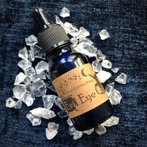 Evil Eye Oil - Protection/Ward Negativity - Herb/Crystal Blend - Castor Oil/Vitamin E Oil/Essential Oil Blend - 15ml Blue Glass Bottle