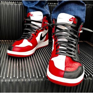 May include: A pair of red, black, and white high-top sneakers with black laces. The sneakers have a white midsole and a red outsole.