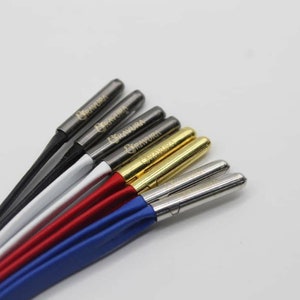 May include: A set of six speaker wire banana plugs with different colored jackets. The plugs are labeled "Banana Plug" and are made of metal.