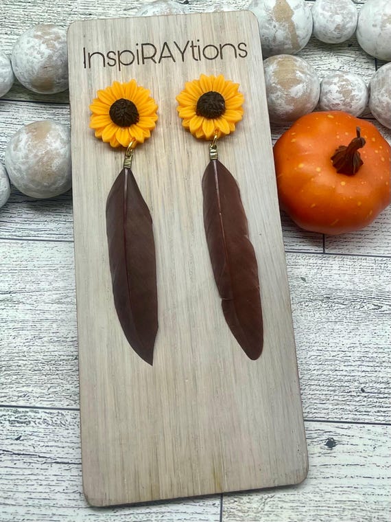 Sunflower stud earrings with feather accent