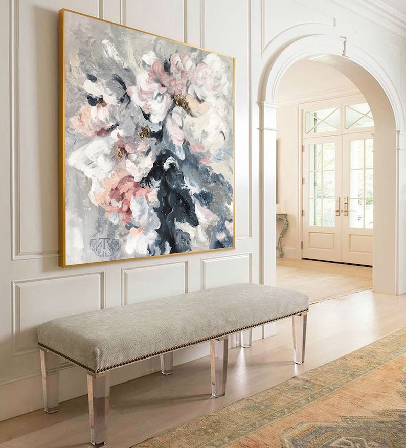 May include: A large abstract painting of pink and white flowers with gray and blue accents hangs above a white bench with clear acrylic legs. The bench is in a hallway with a rug on the floor.
