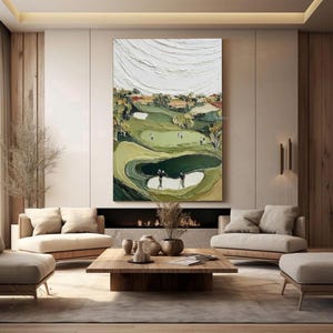 May include: Large abstract painting of a golf course with textured white clouds and green fairways. The artwork depicts golfers on the course, with sand traps and trees. The painting is displayed in a modern living room setting.