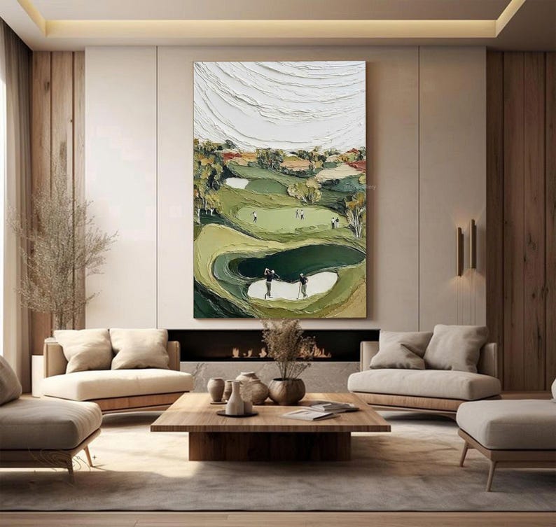 May include: Large abstract painting of a golf course with textured white clouds and green fairways. The artwork depicts golfers on the course, with sand traps and trees. The painting is displayed in a modern living room setting.