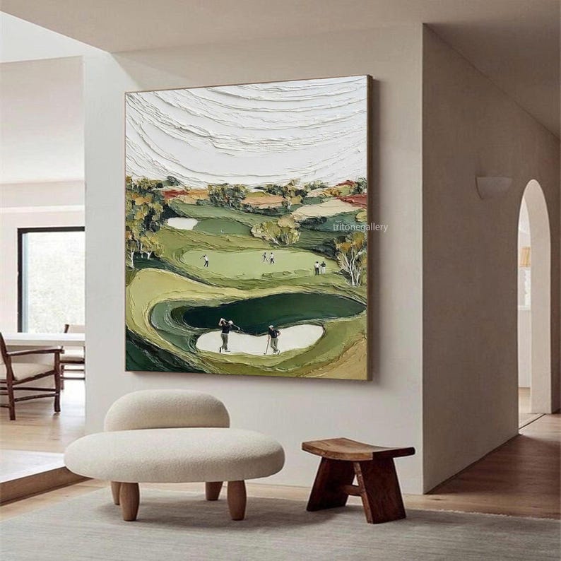 May include: Textured oil painting of a golf course with players. The artwork features a green golf course with sand traps, trees, and a textured white sky. The painting has a neutral color palette with green, brown, and white tones.