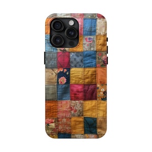 May include: A colorful patchwork phone case with a variety of fabrics and patterns. The case is designed for a phone with a triple camera lens.