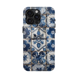 May include: A blue and white patterned phone case with a geometric design. The case has a raised camera bump with three lenses.