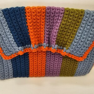 Unique and stylish crochet clutch style bag is a perfect blend of vibrant colors and classic design.