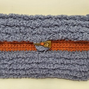 Unique and stylish crochet clutch style bag is a perfect blend of vibrant colors and classic design.