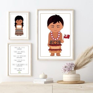 May include: Two framed prints with illustrations of children wearing traditional Tongan clothing. The boy is holding a Tongan flag. The girl is wearing a red and white patterned dress. The prints are on a white wall with a vase of flowers and a book on a wooden shelf.