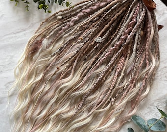 May include: A set of synthetic hair extensions in shades of blonde, brown, and pink. The extensions are braided and decorated with beads and charms.