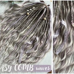 May include: A set of long, wavy synthetic dreadlocks in shades of gray and lavender with white and brown accents. The dreadlocks are decorated with small white seashells and a white lace ribbon. The text "EASY COMB waves" is visible at the bottom of the image.