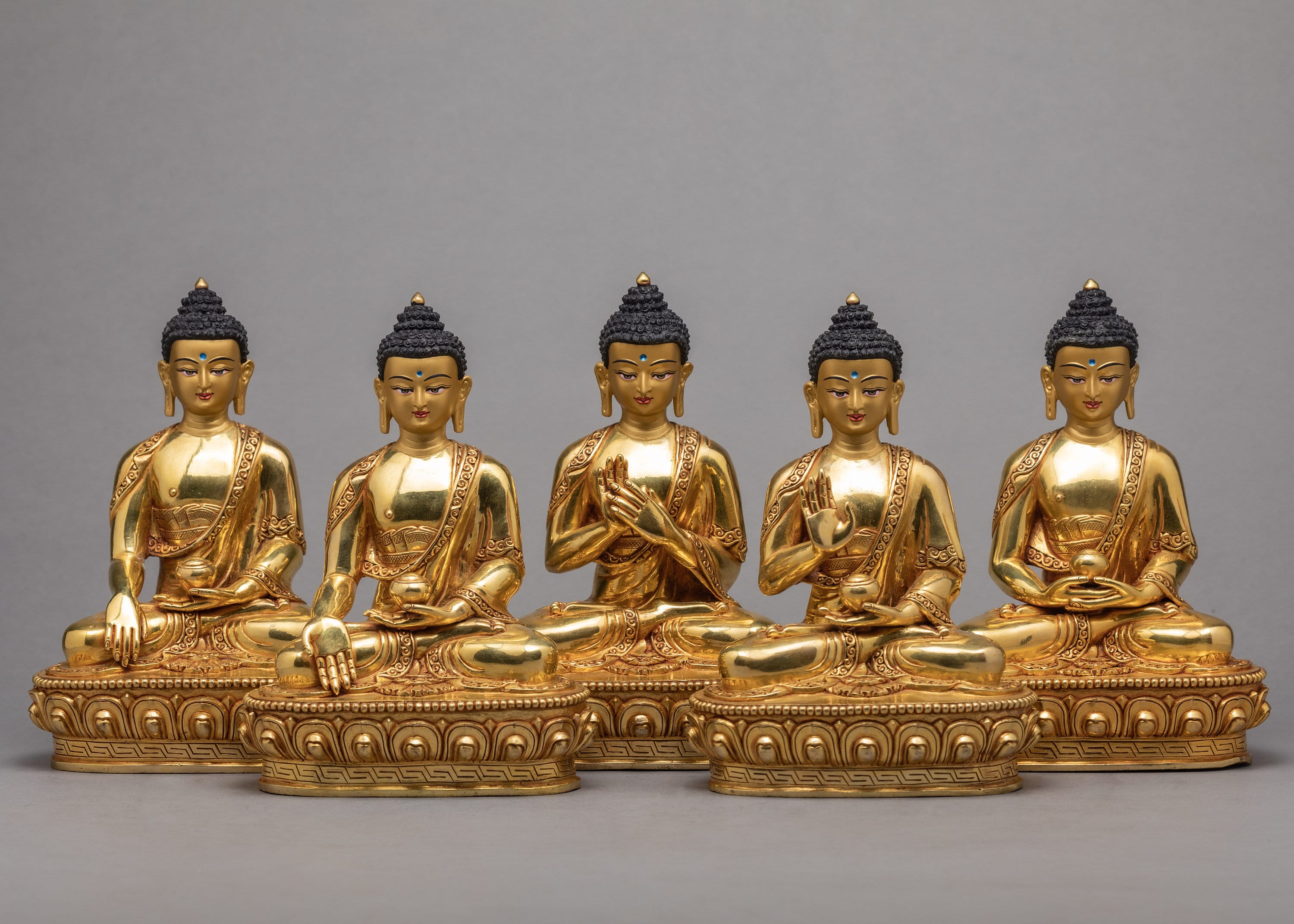 Why do I often see Buddha statues with one hand raised? - Quora