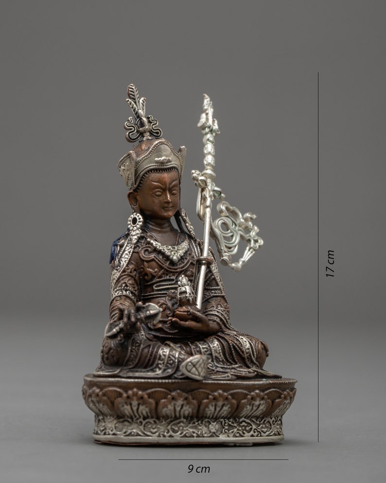 May include: A small, ornate bronze statue of a seated figure with a silver crown and scepter. The statue is 9 inches wide and 17 inches tall.