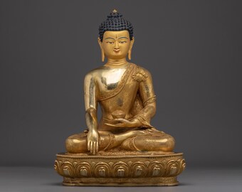 瞑想する釈迦牟尼仏の黄金銅像 | 悟り、マインドフルネス、そして精神