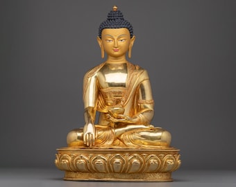 Goldene Gautama Buddha Statue: Der Erleuchtete, meisterlich gefertigt mit 24K Gold Vergoldung für friedliches Ambiente und spirituelle Reflektion
