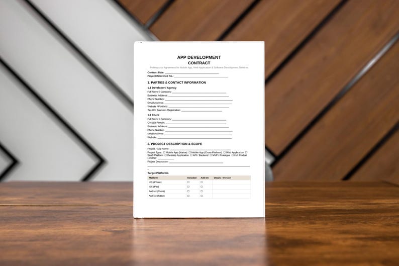 May include: A white document titled "APP DEVELOPMENT CONTRACT" stands upright on a wooden surface. The document contains lines for filling in information about the project, parties, and scope. The background features a mix of white and brown wooden panels.