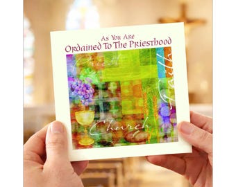 May include: A cream-colored card with the text "As You Are Ordained To The Priesthood" in purple and green. The card features a watercolor illustration of grapes, a chalice, wheat, and bread. The word "Church" is written in cursive.