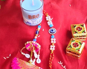 Handmade Evil Eye couple rakhi with handcrafted scented candle