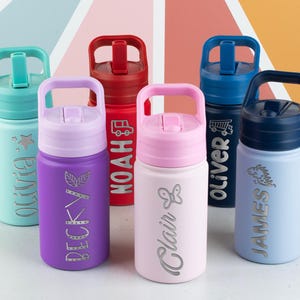 May include: Six stainless steel water bottles with carrying handles and straw lids in teal, purple, red, light pink, dark blue, and light blue. Each bottle is personalized with a name and a small icon, including Olivia, Becky, Noah, Clair, Oliver, and James.