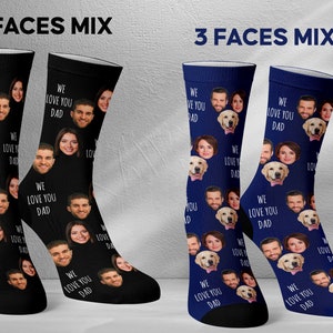 May include: Two pairs of socks with different designs. One pair is black with a white "We Love You Dad" text and multiple faces. The other pair is blue with a white "We Love You Dad" text and multiple faces.